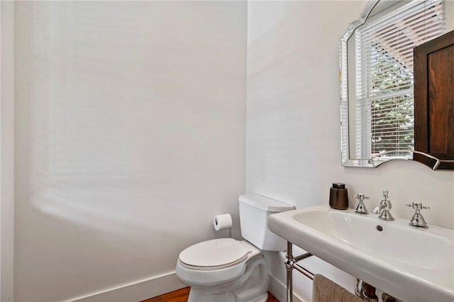 bathroom with sink and toilet