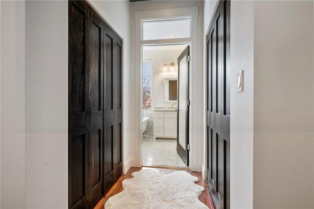 hallway with light wood-type flooring