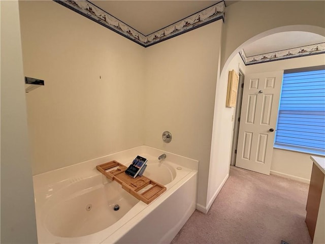 bathroom featuring a tub to relax in