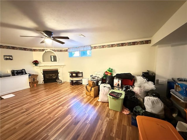 living room featuring hardwood / wood-style flooring and ceiling fan