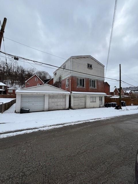 view of front of property with an outbuilding and a garage