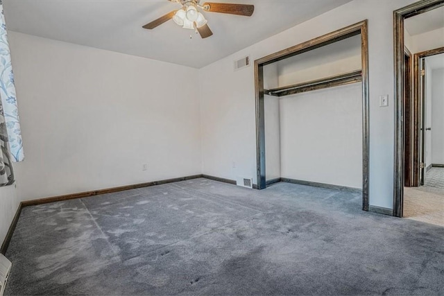 unfurnished bedroom with carpet, ceiling fan, and a closet