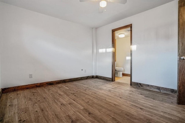 empty room with ceiling fan and light wood-type flooring