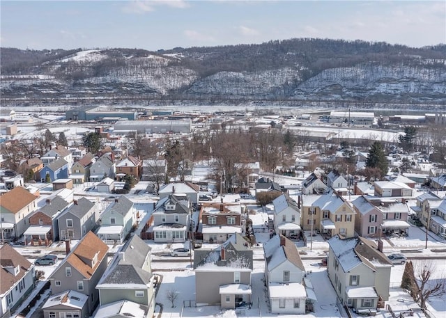 snowy aerial view featuring a mountain view