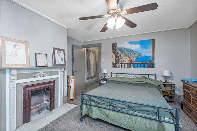 carpeted bedroom with crown molding and ceiling fan