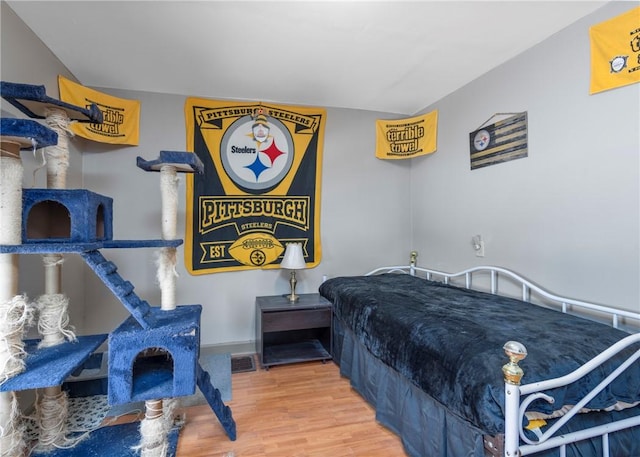 bedroom featuring hardwood / wood-style floors