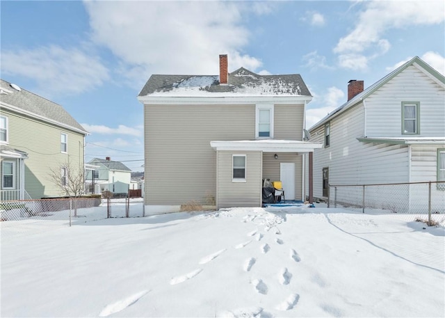 view of snow covered property