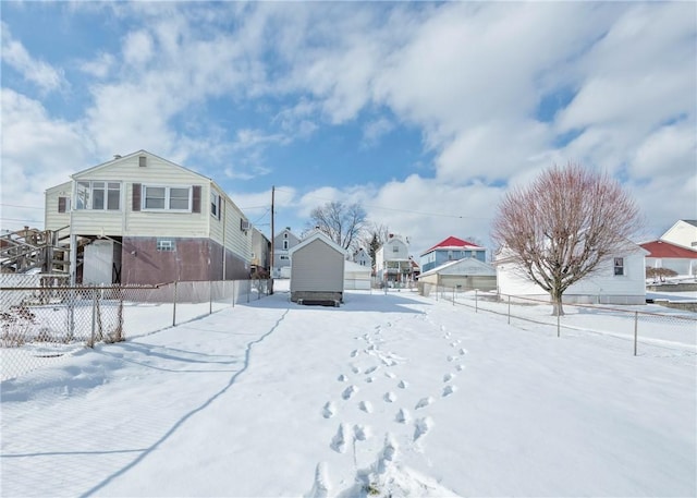 view of yard layered in snow