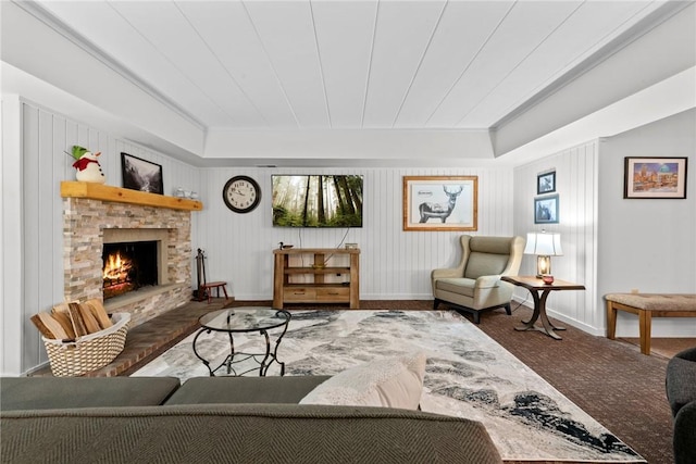 living room with a stone fireplace