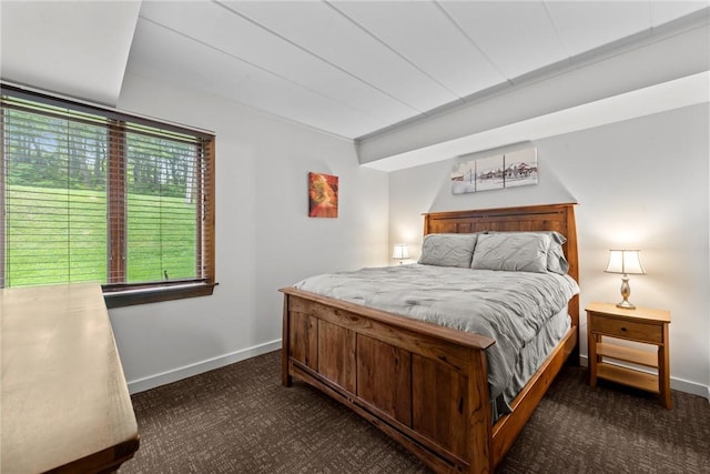 bedroom with dark carpet