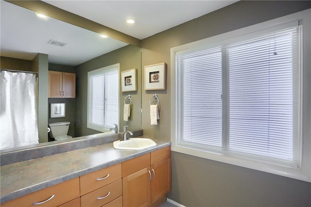 bathroom with vanity and toilet