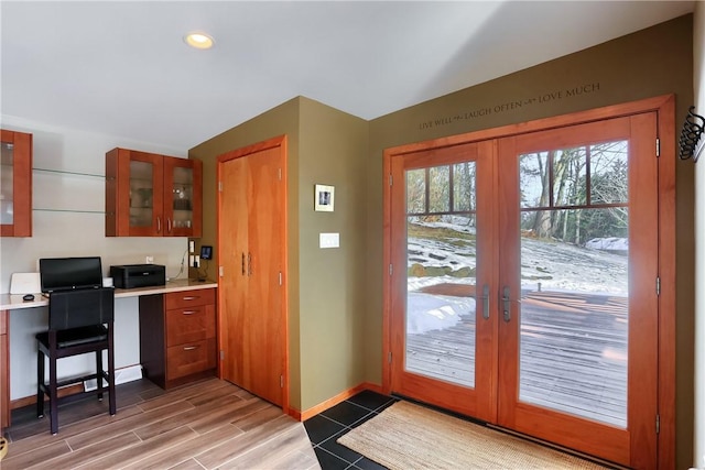 doorway featuring built in desk and french doors