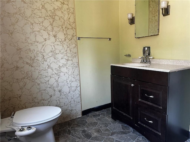 bathroom with vanity and toilet