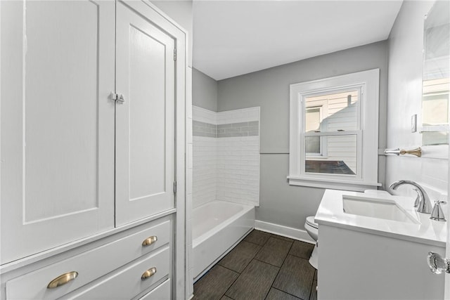 full bathroom featuring vanity, toilet, and  shower combination