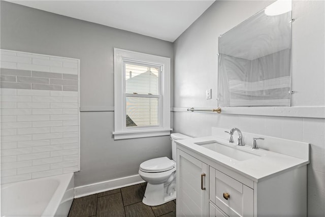 full bathroom with vanity, wood-type flooring, bathing tub / shower combination, and toilet