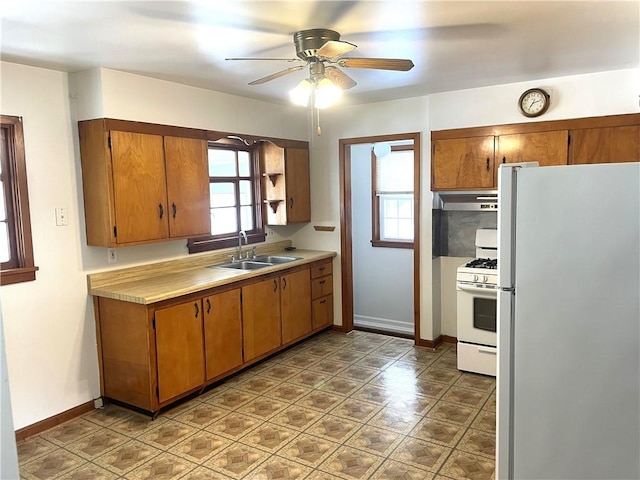 kitchen with ceiling fan, white appliances, and sink