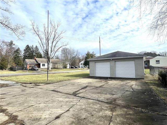 garage featuring a lawn