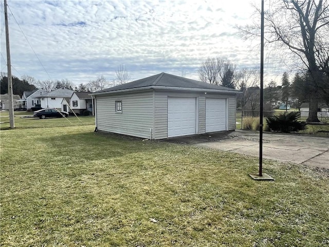 garage with a lawn