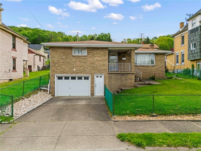 view of front of property featuring a garage and a front lawn