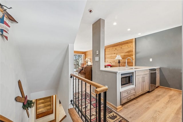 interior space featuring sink and light wood-type flooring