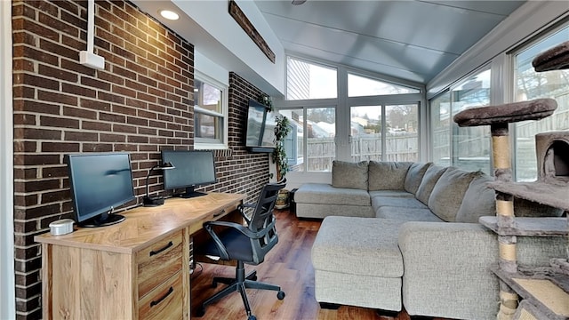 office with vaulted ceiling and dark hardwood / wood-style floors