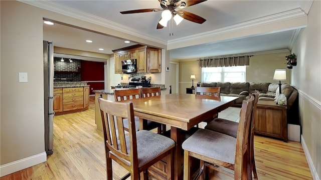 dining area featuring ornamental molding, ceiling fan, and light wood-type flooring