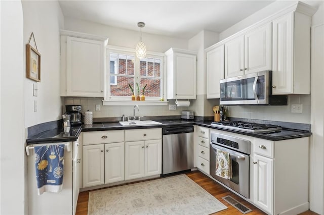 kitchen featuring white cabinetry, sink, and stainless steel appliances