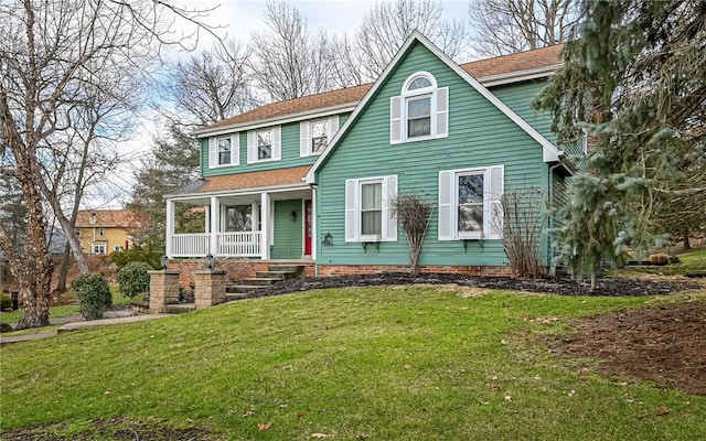 view of front facade with a front lawn and a porch