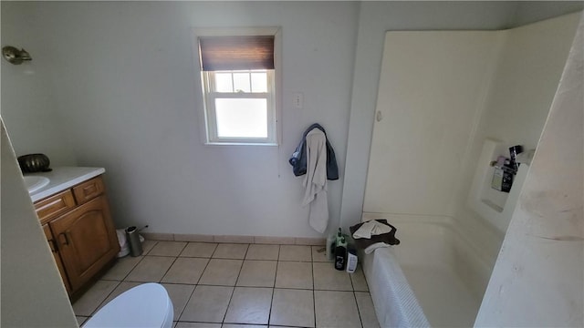 bathroom featuring tile patterned floors, toilet, and vanity