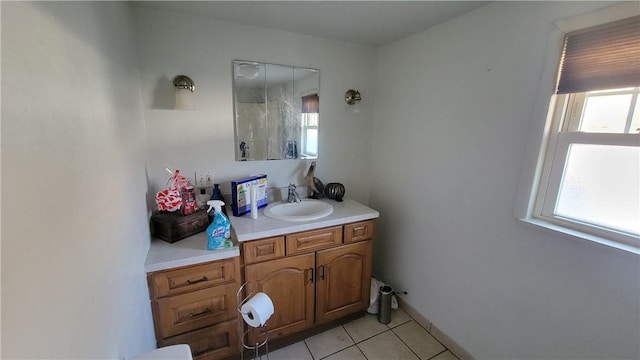 bathroom featuring tile patterned flooring and vanity