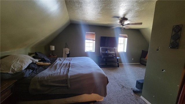 carpeted bedroom featuring ceiling fan, vaulted ceiling, and a textured ceiling