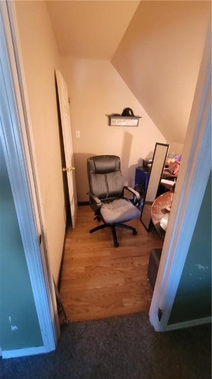 sitting room featuring wood-type flooring and lofted ceiling