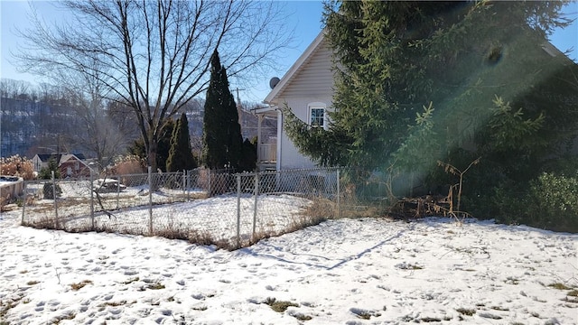 view of yard layered in snow