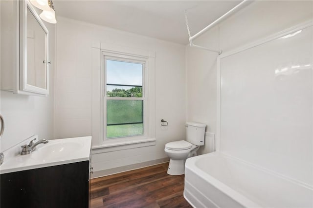 full bathroom with vanity, tub / shower combination, wood-type flooring, and toilet