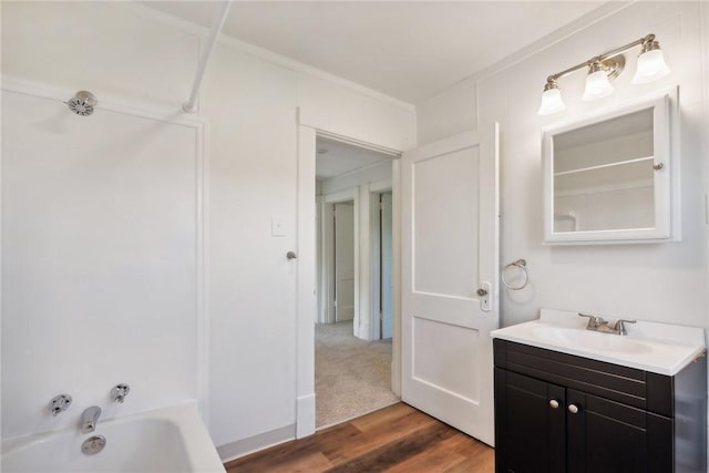 bathroom featuring vanity, hardwood / wood-style floors, and tub / shower combination