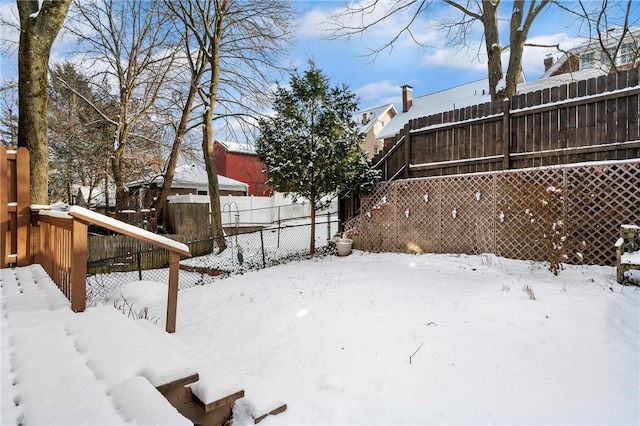 view of yard covered in snow