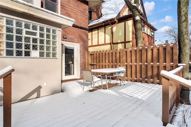 view of snow covered deck