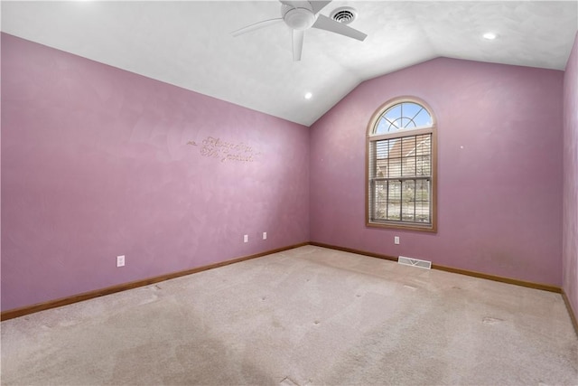 carpeted empty room featuring lofted ceiling and ceiling fan