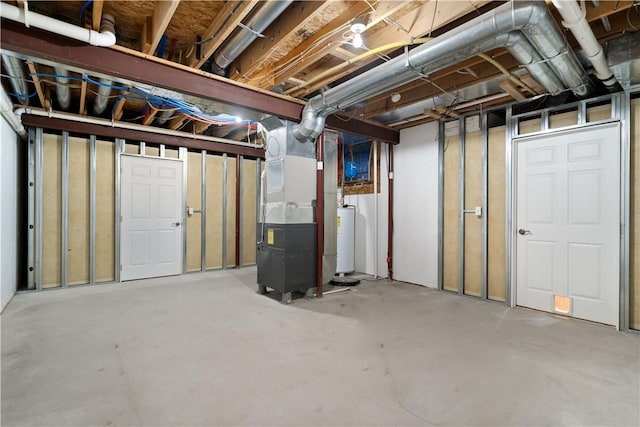 basement featuring gas water heater and heating unit