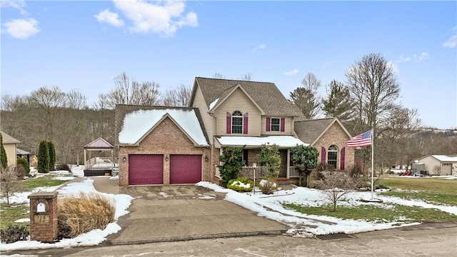 view of front of house with a garage and a porch