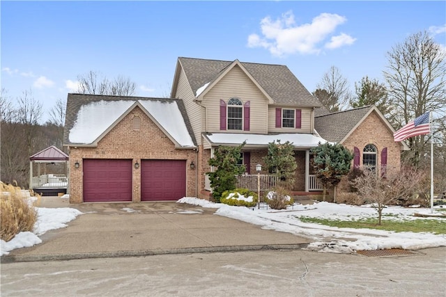 view of front property with a garage and a porch