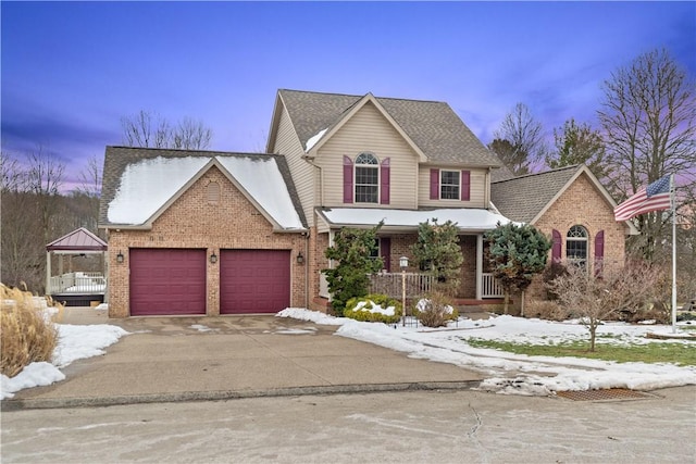 view of front property with a garage and covered porch