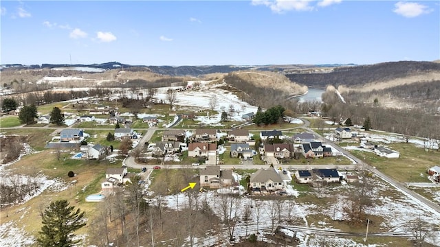 snowy aerial view with a mountain view