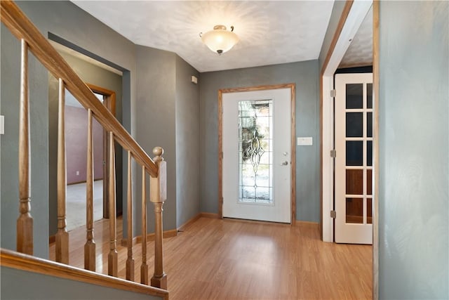 entrance foyer with light hardwood / wood-style floors