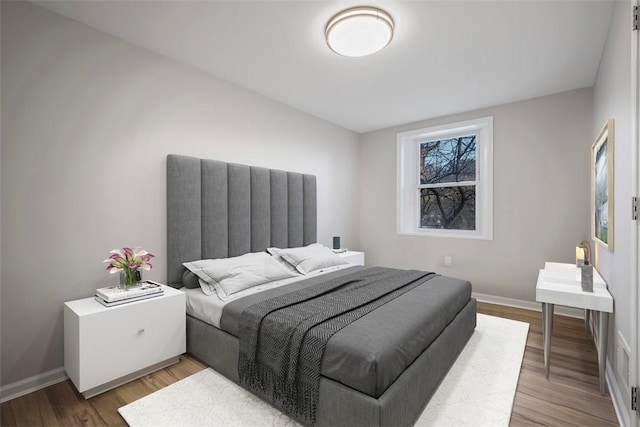 bedroom featuring hardwood / wood-style floors