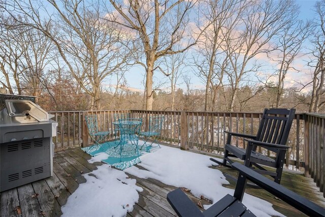 wooden terrace with outdoor dining space