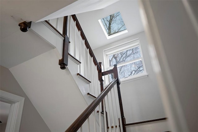 stairs with lofted ceiling