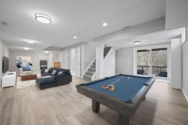 rec room with light hardwood / wood-style flooring and billiards