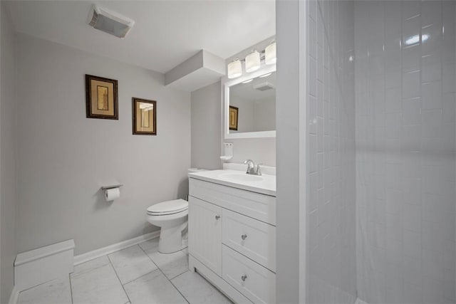 bathroom featuring baseboards, toilet, marble finish floor, a tile shower, and vanity