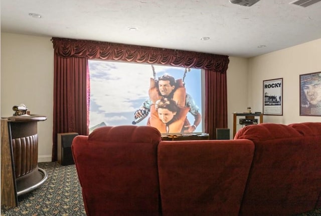 home theater room featuring carpet floors and a wealth of natural light